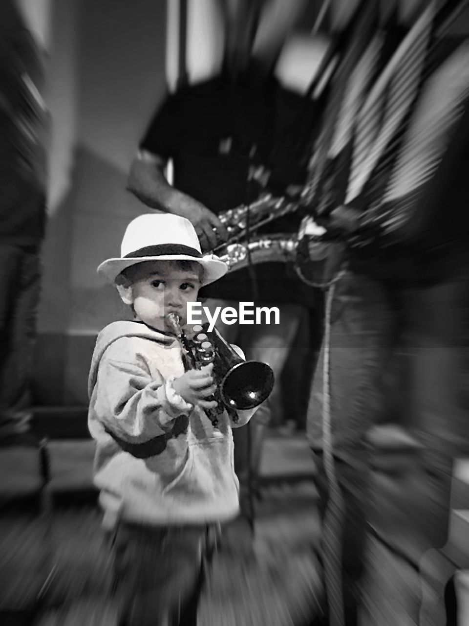 FULL LENGTH PORTRAIT OF BOY HOLDING HAT