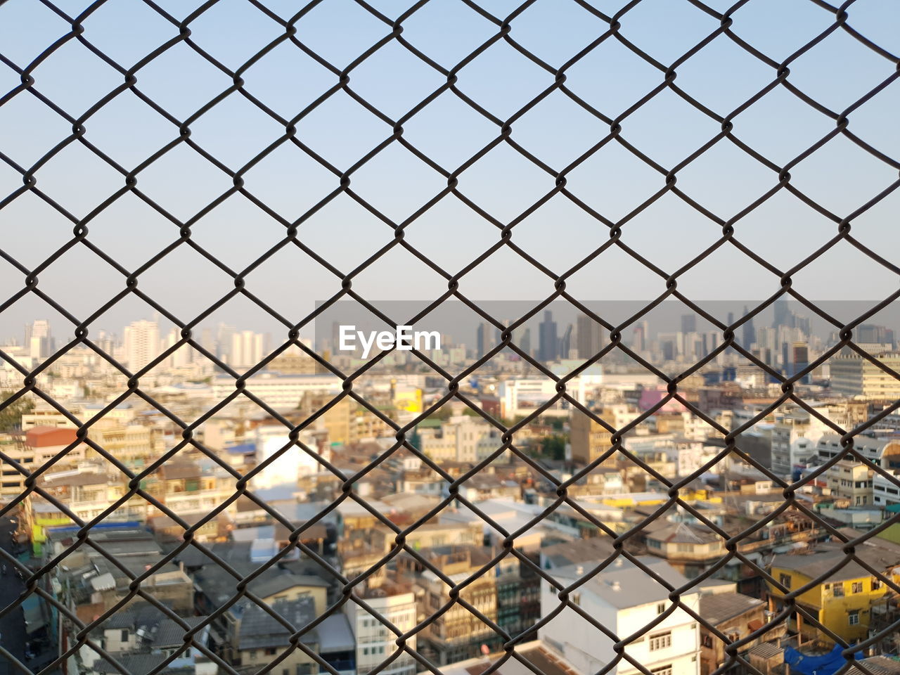 Full frame shot of chainlink fence against sky