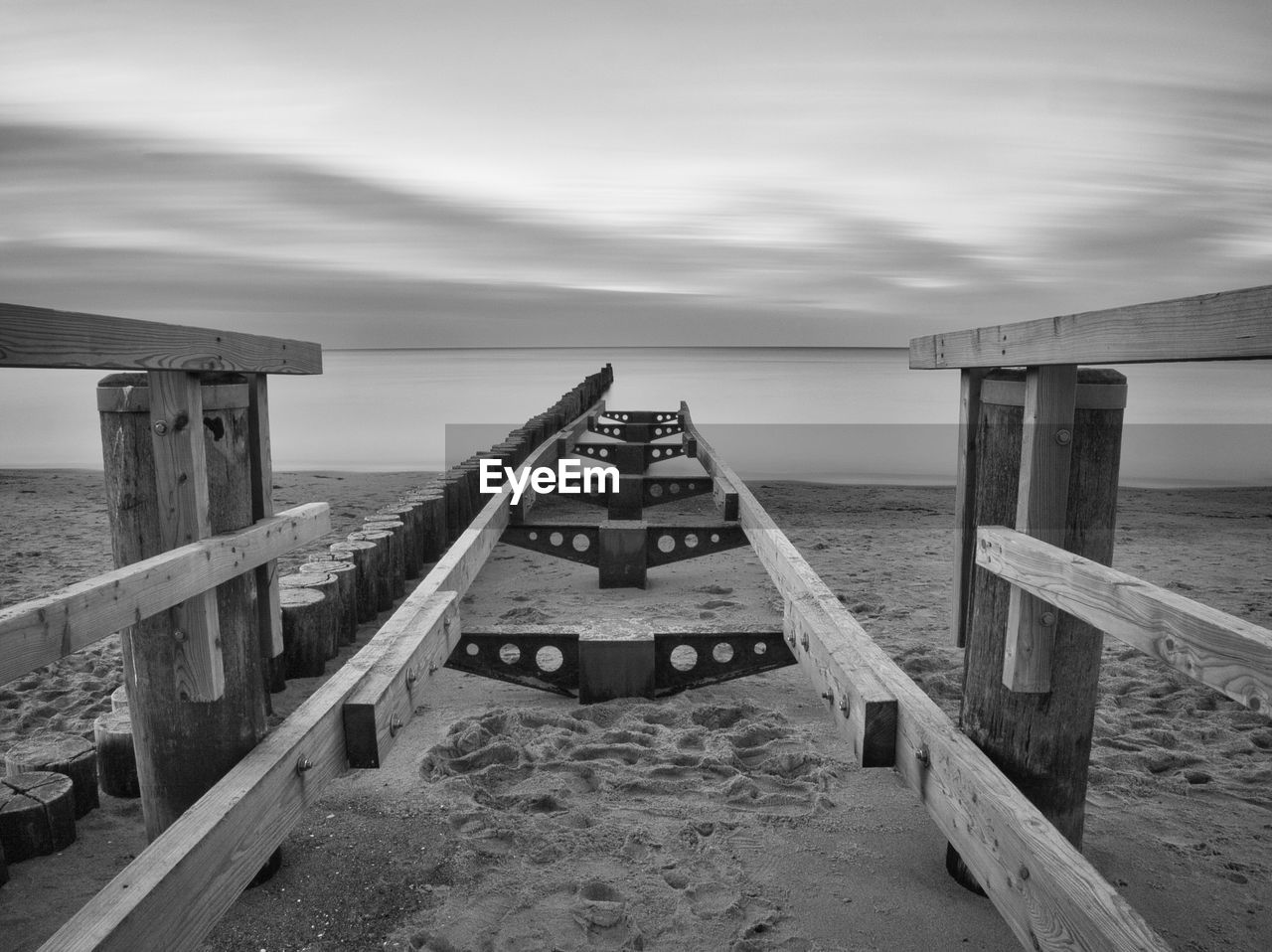 Pier over sea against sky