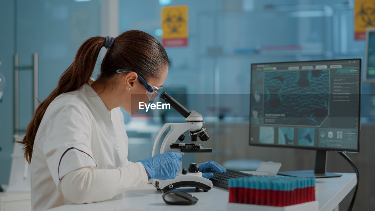 Female scientist experimenting at laboratory