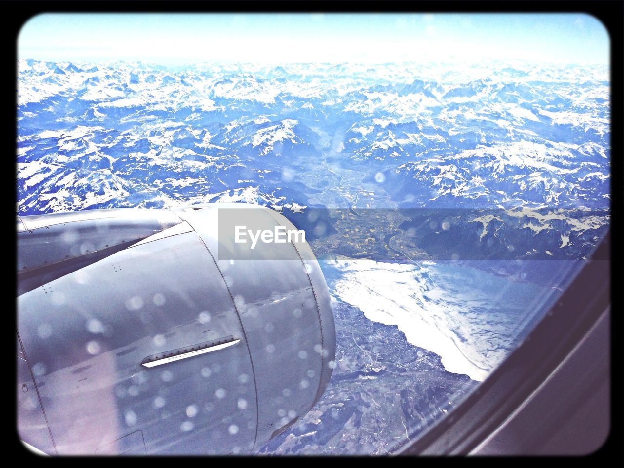 Majestic view of snowcapped mountain viewed from airplane window