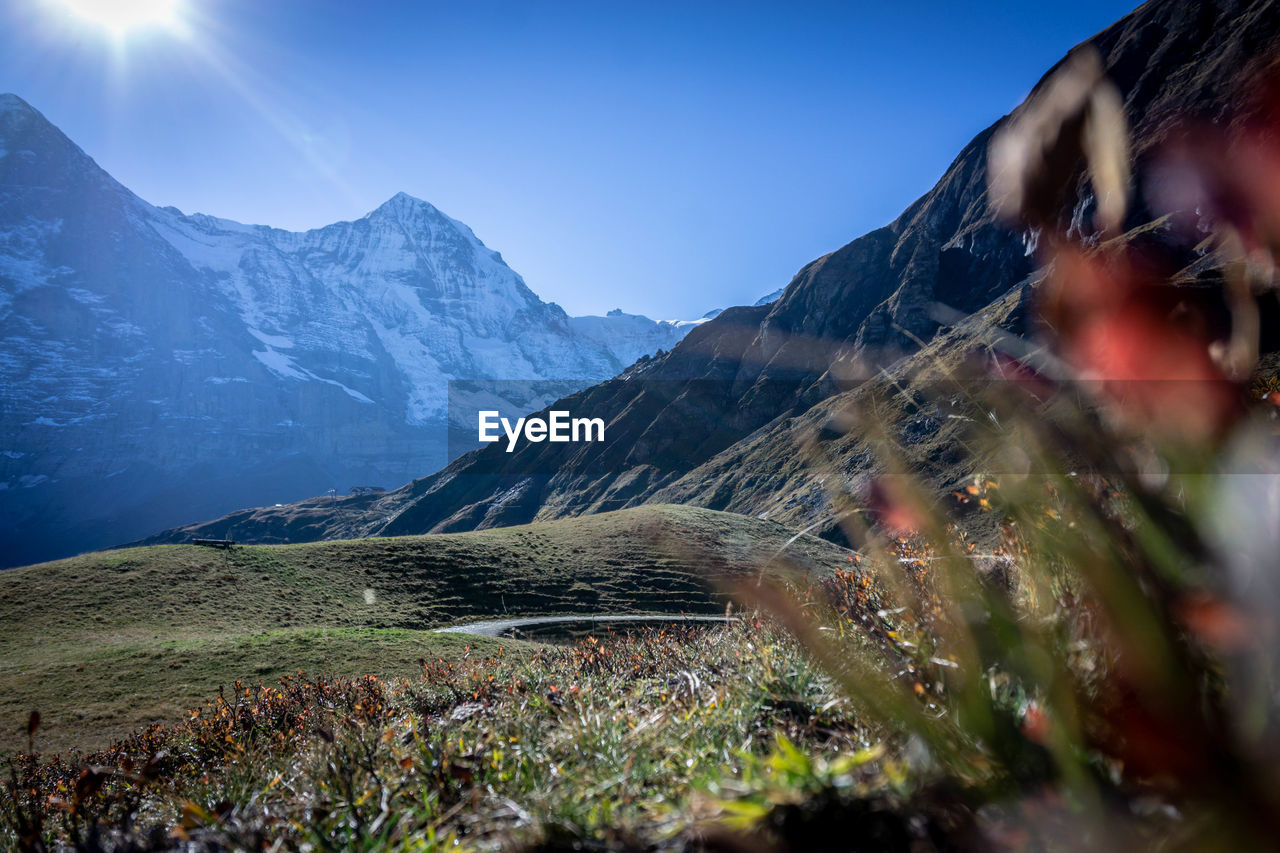 Scenic view of snowcapped mountains against clear sky