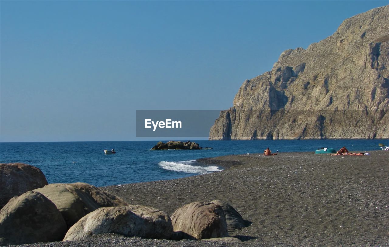 Scenic view of sea against clear blue sky