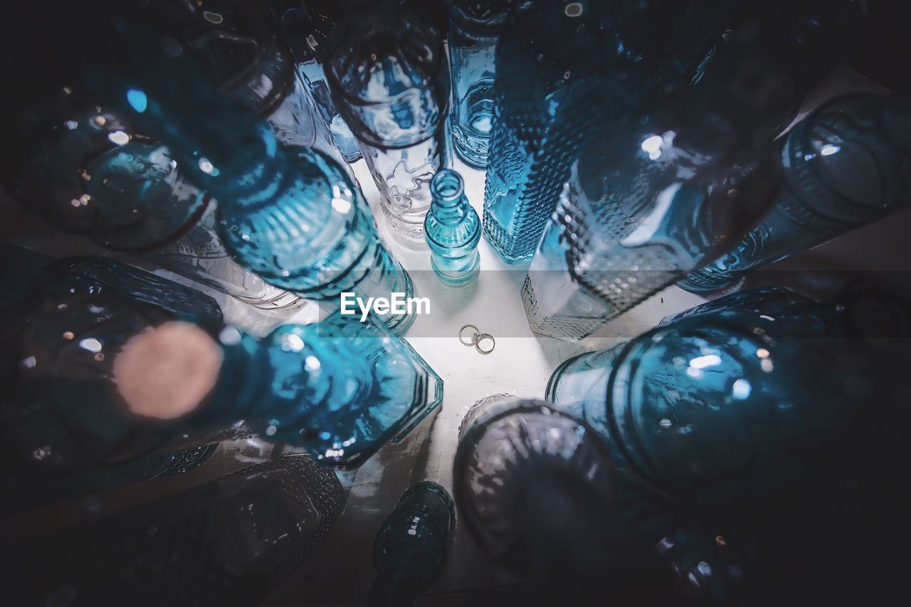 Wedding rings among empty bottles