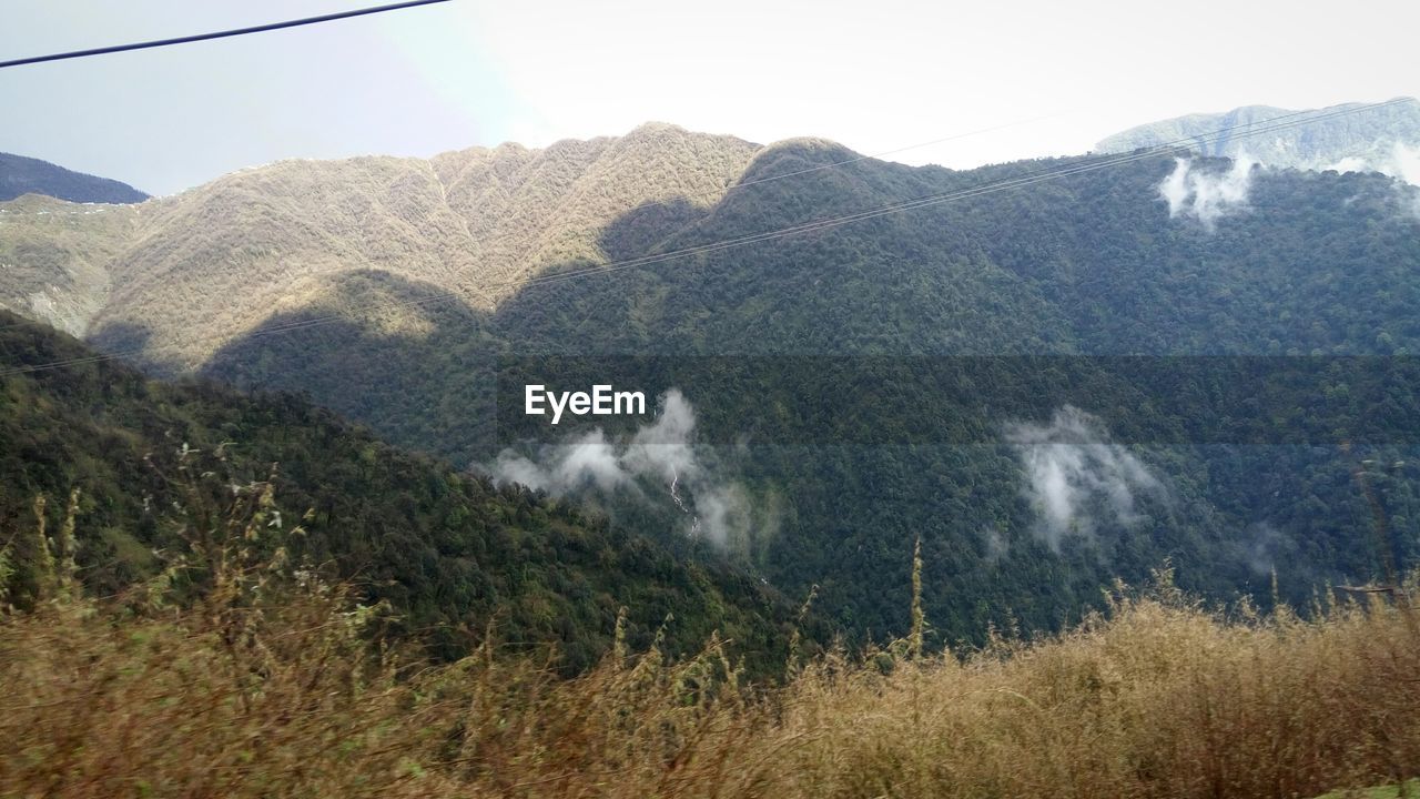 SCENIC VIEW OF MOUNTAINS AND MOUNTAINS