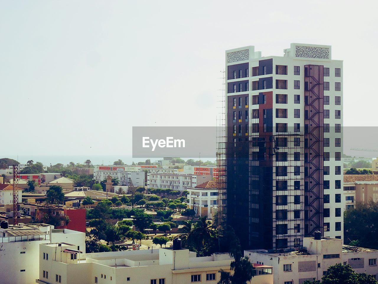 BUILDINGS AGAINST CLEAR SKY