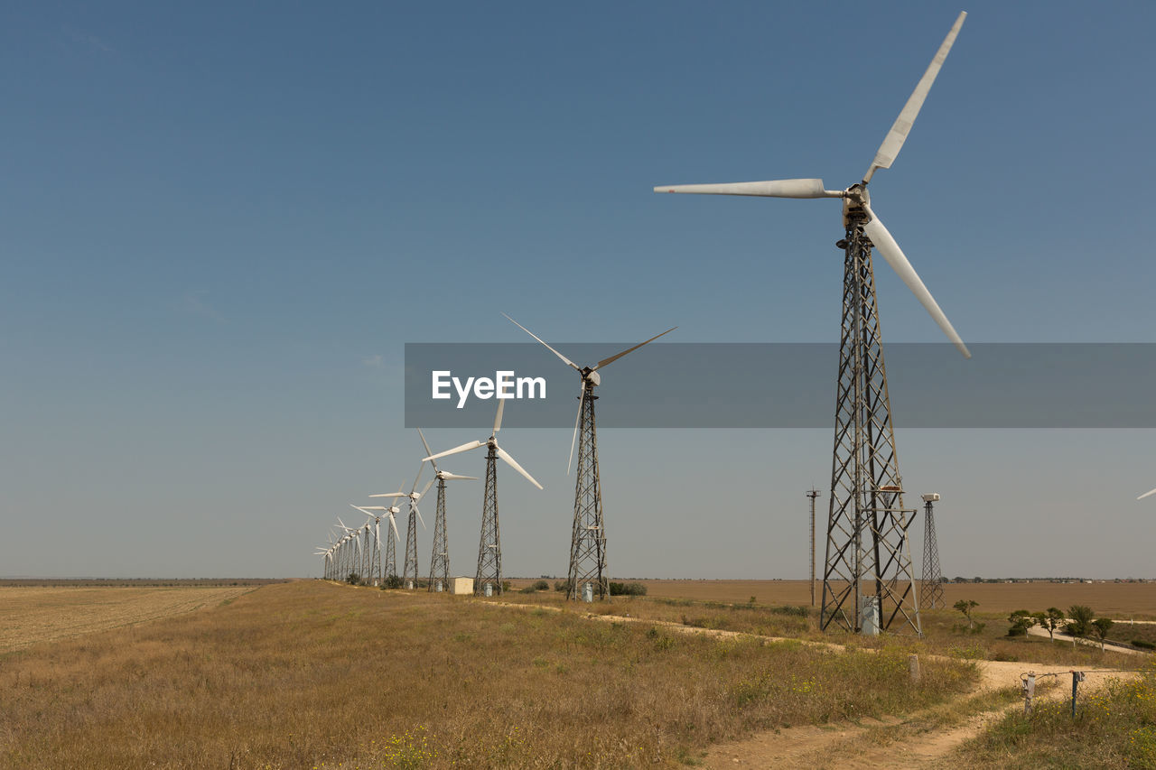 WIND TURBINES ON FIELD