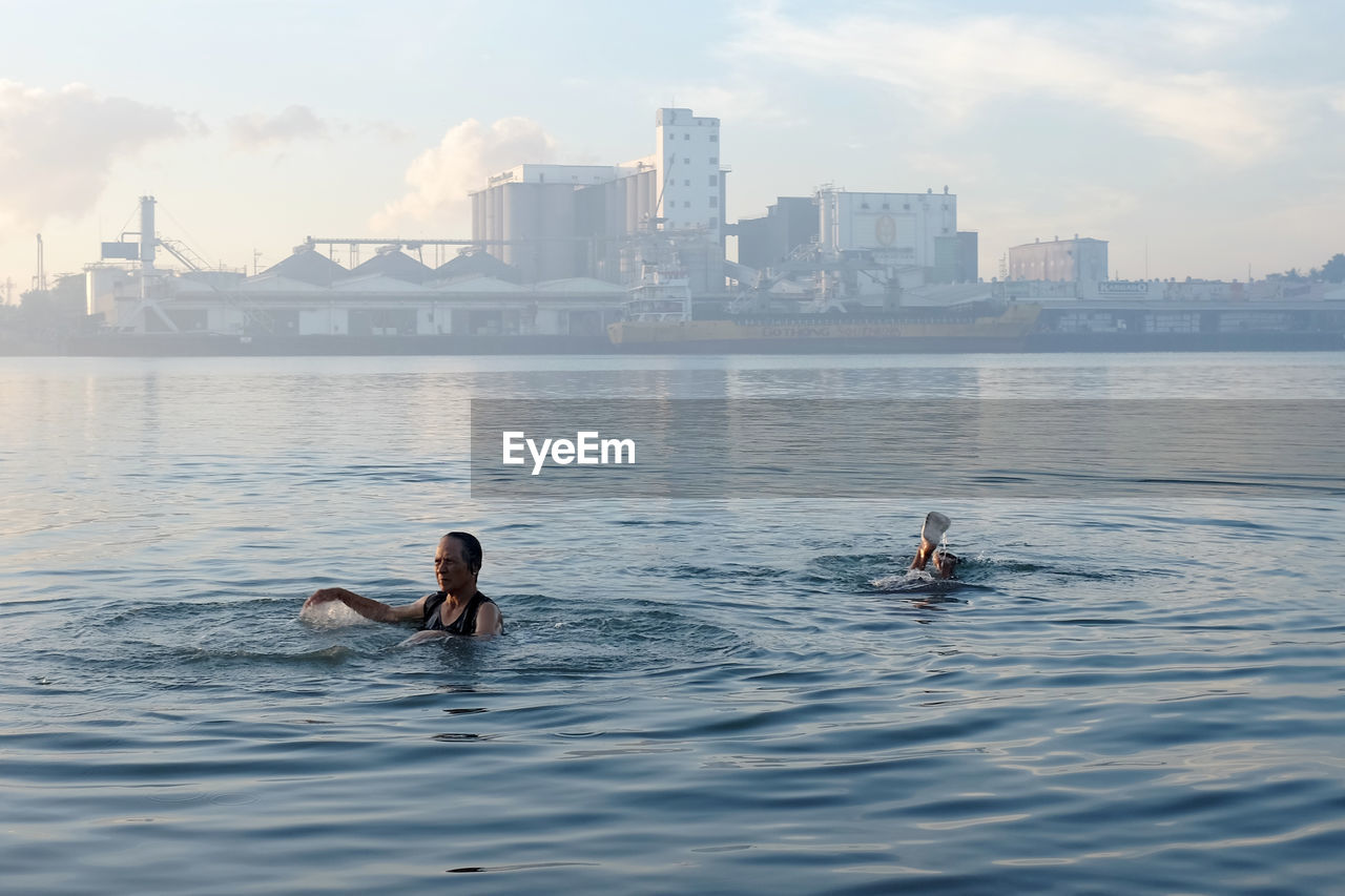VIEW OF PEOPLE IN WATER