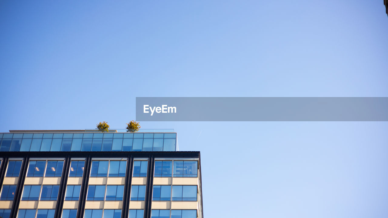 blue, sky, architecture, clear sky, copy space, built structure, building exterior, low angle view, building, nature, day, no people, reflection, facade, outdoors, city, skyscraper, tower block, sunny