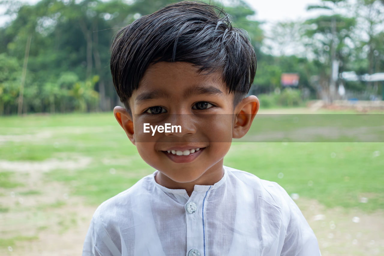 PORTRAIT OF BOY SMILING