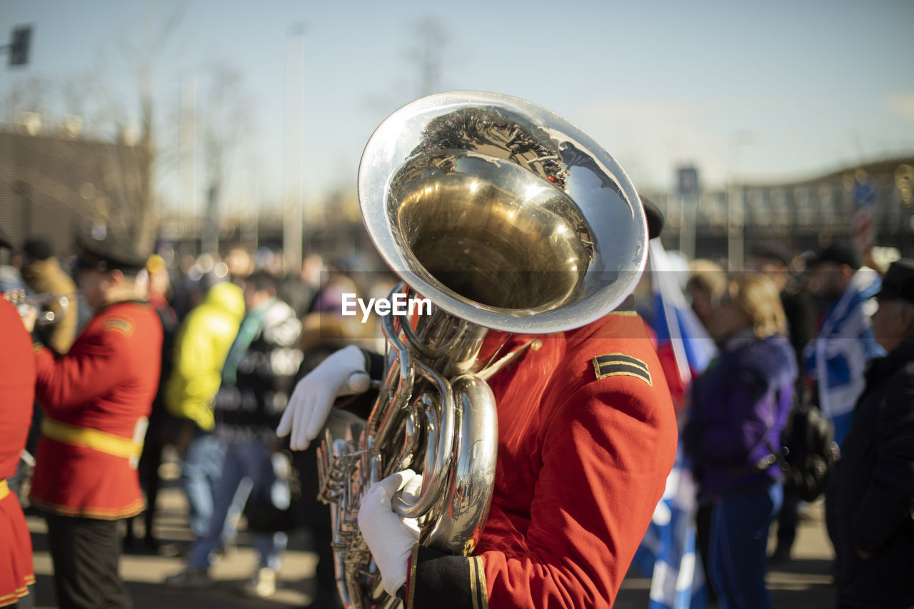 Trumpeter of military band. wind instrument. music performance. military parade.