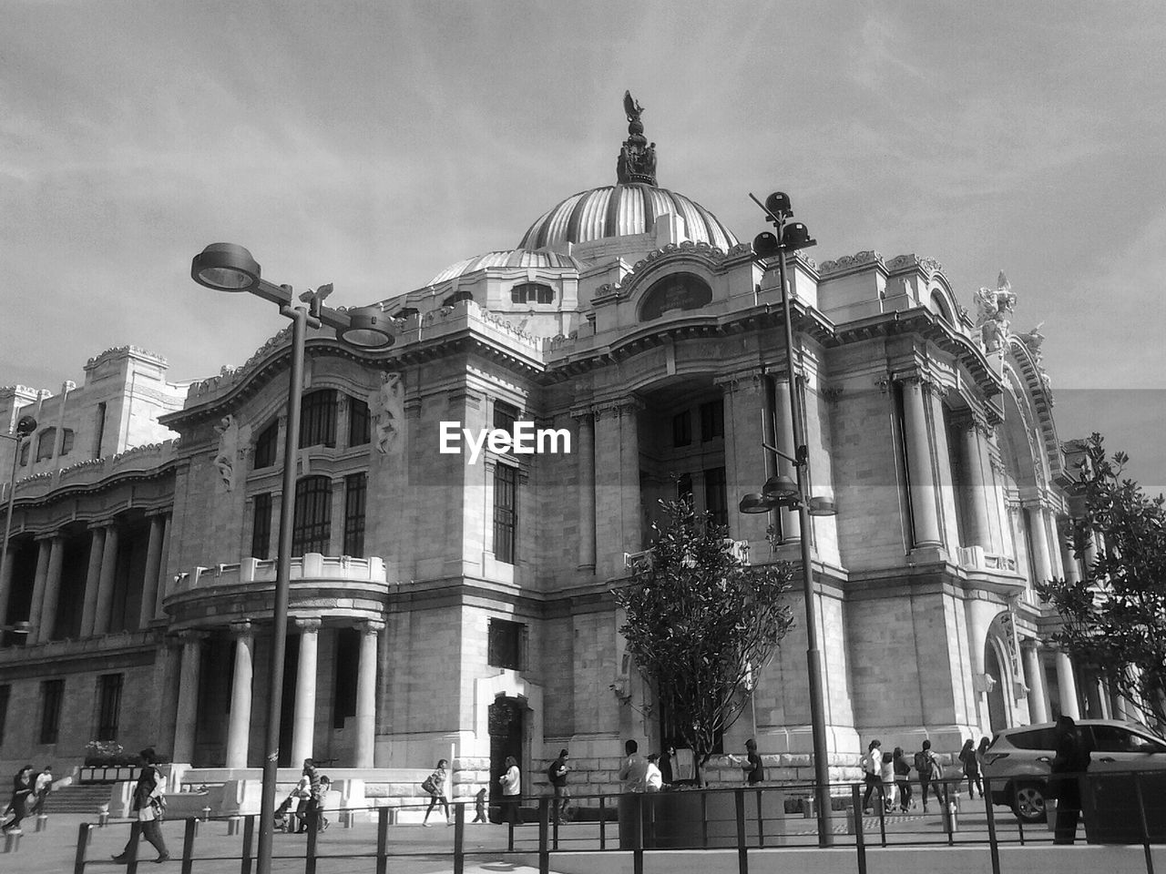 Tourist at palacio de bellas artes against sky