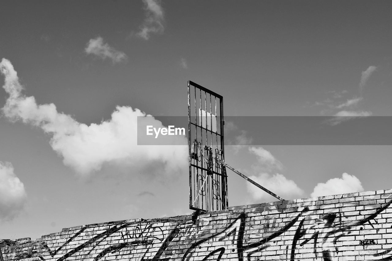 sky, black and white, cloud, monochrome, monochrome photography, white, architecture, built structure, nature, no people, building exterior, snow, day, low angle view, outdoors, black, building