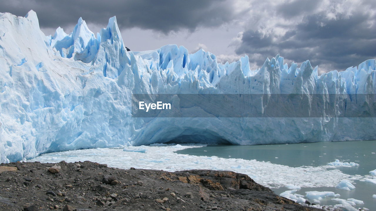 Panoramic view of frozen sea against sky