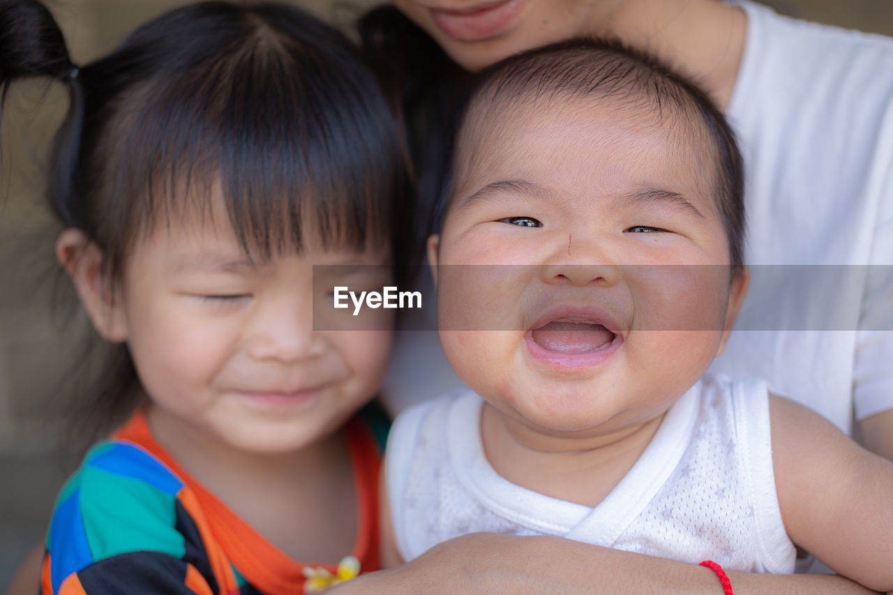 PORTRAIT OF CUTE BABY SMILING