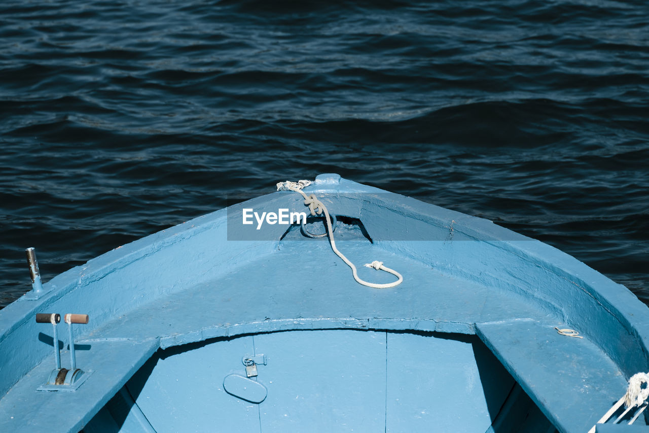 Cropped image of blue boat in lake