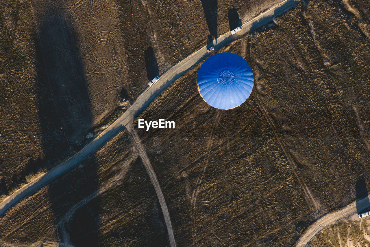 Aerial view of hot air balloon by road