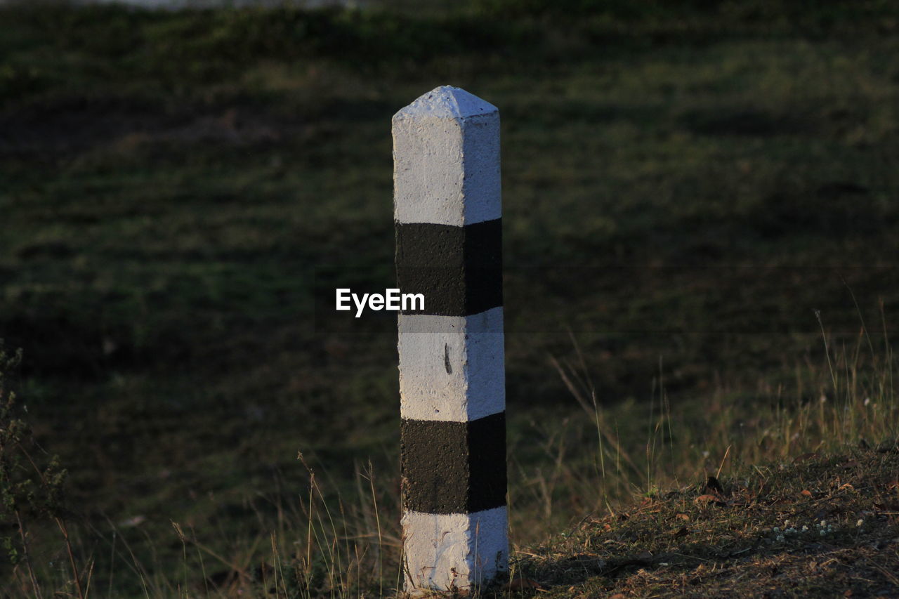 Close-up of cross on field