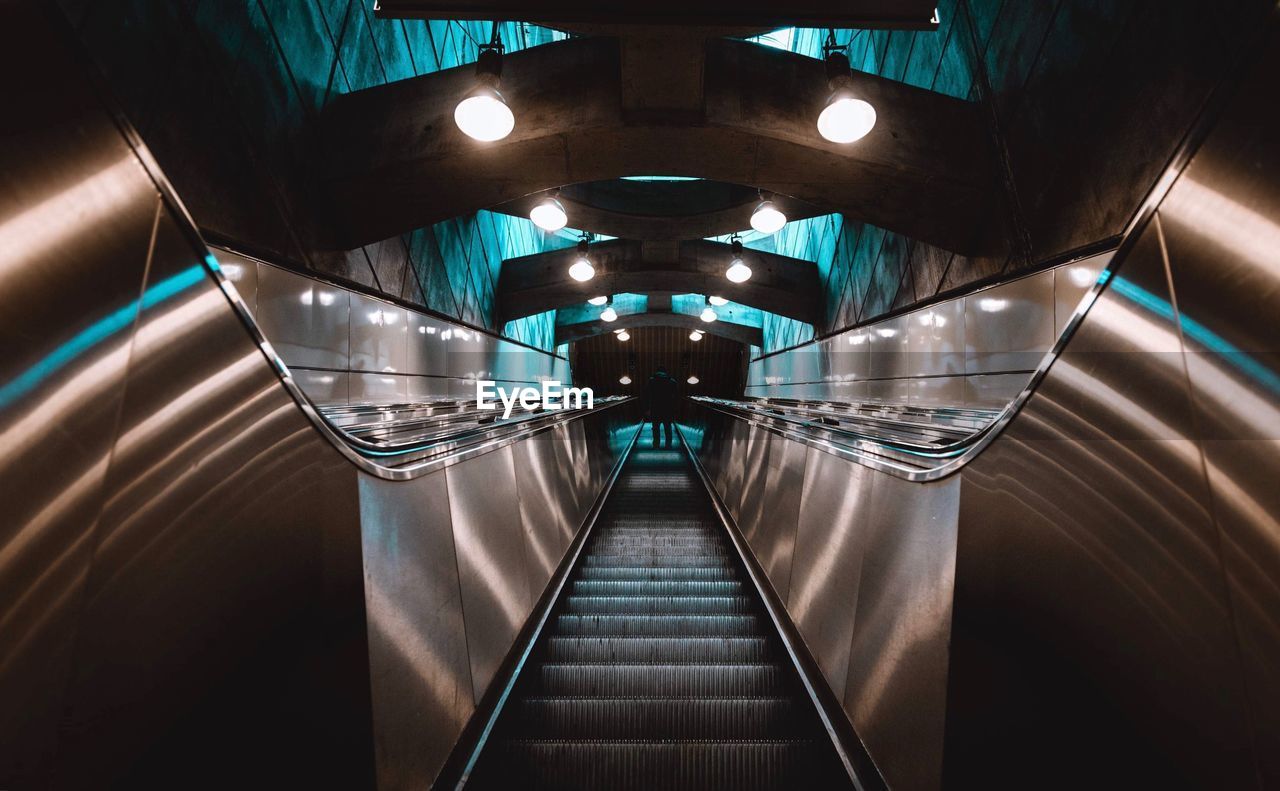 Low angle view of illuminated escalator