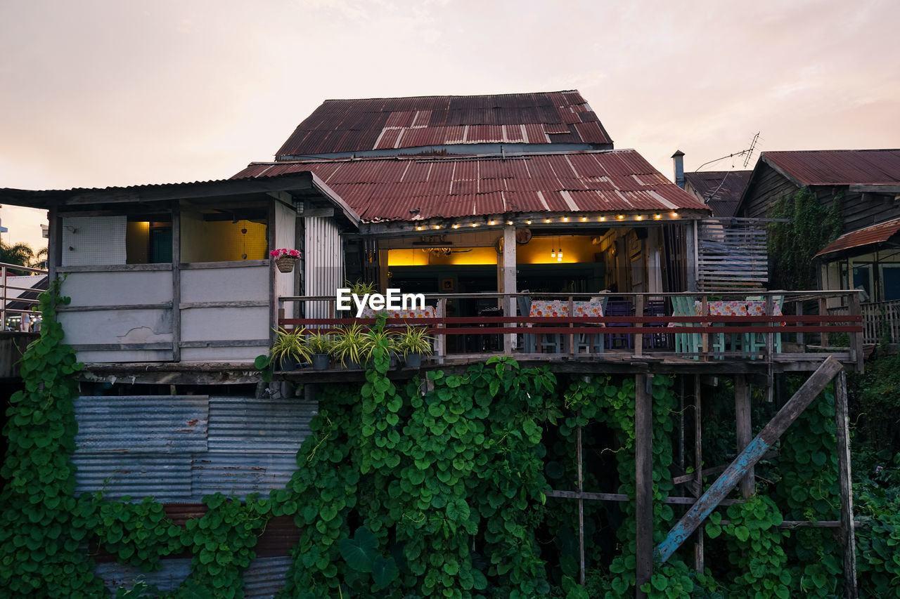 ABANDONED BUILDING AGAINST SKY DURING SUNSET