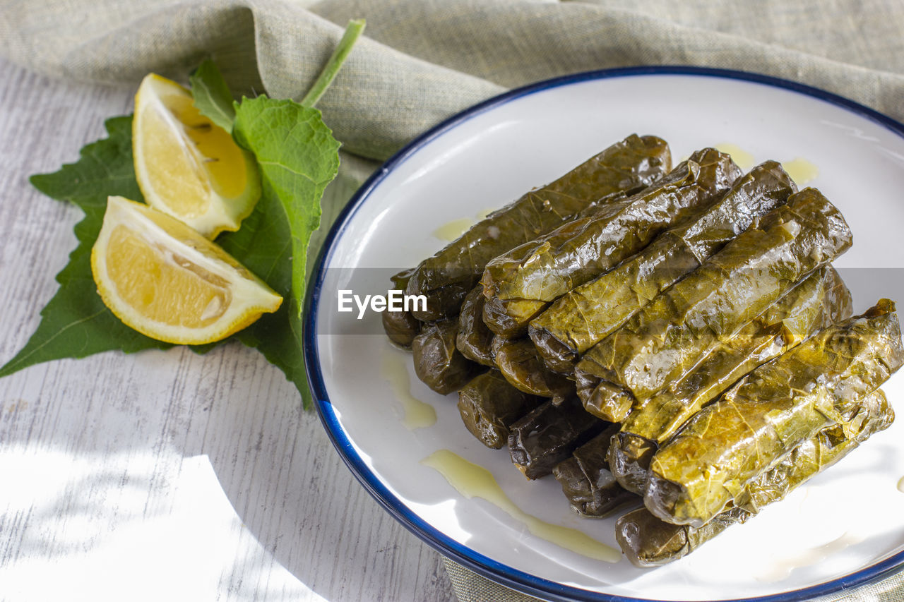 Traditional turkish meal - yaprak dolma. stuffed grape leaves with olive oil and fresh lemon