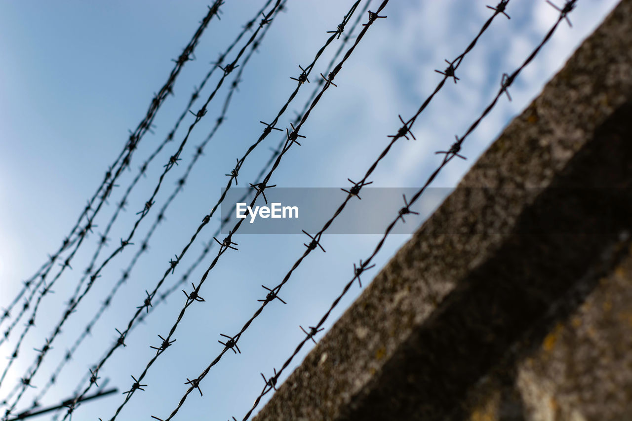 LOW ANGLE VIEW OF FENCE AGAINST SKY