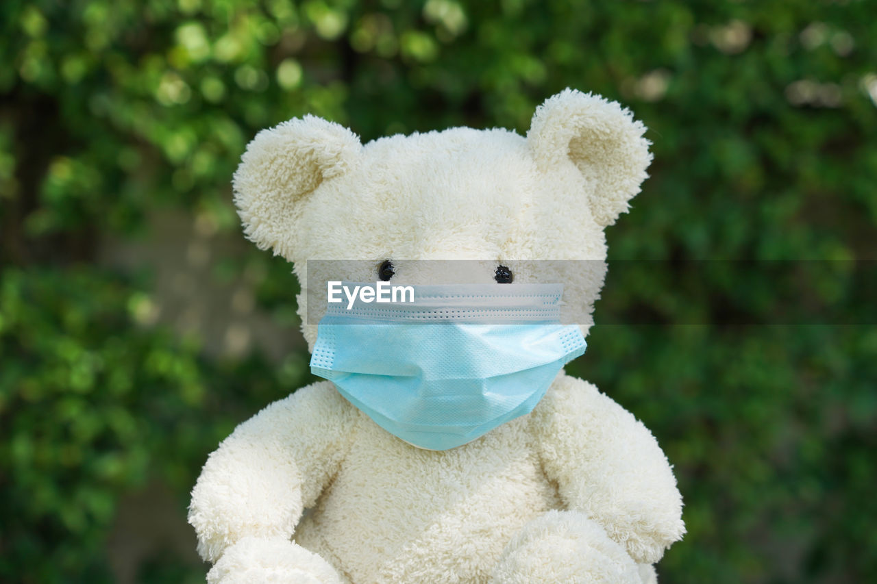 CLOSE-UP OF WHITE TOY ANIMAL