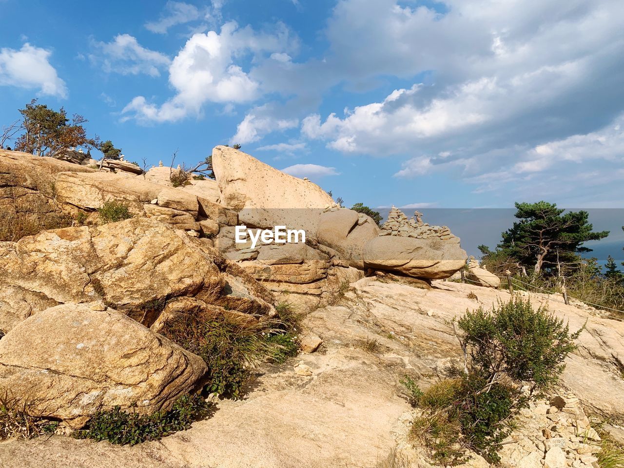 Rock formations on landscape against sky