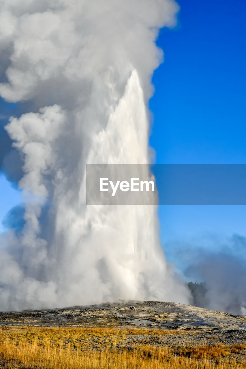 Old faithful geyser in upper geyser basin at yellowstone national park