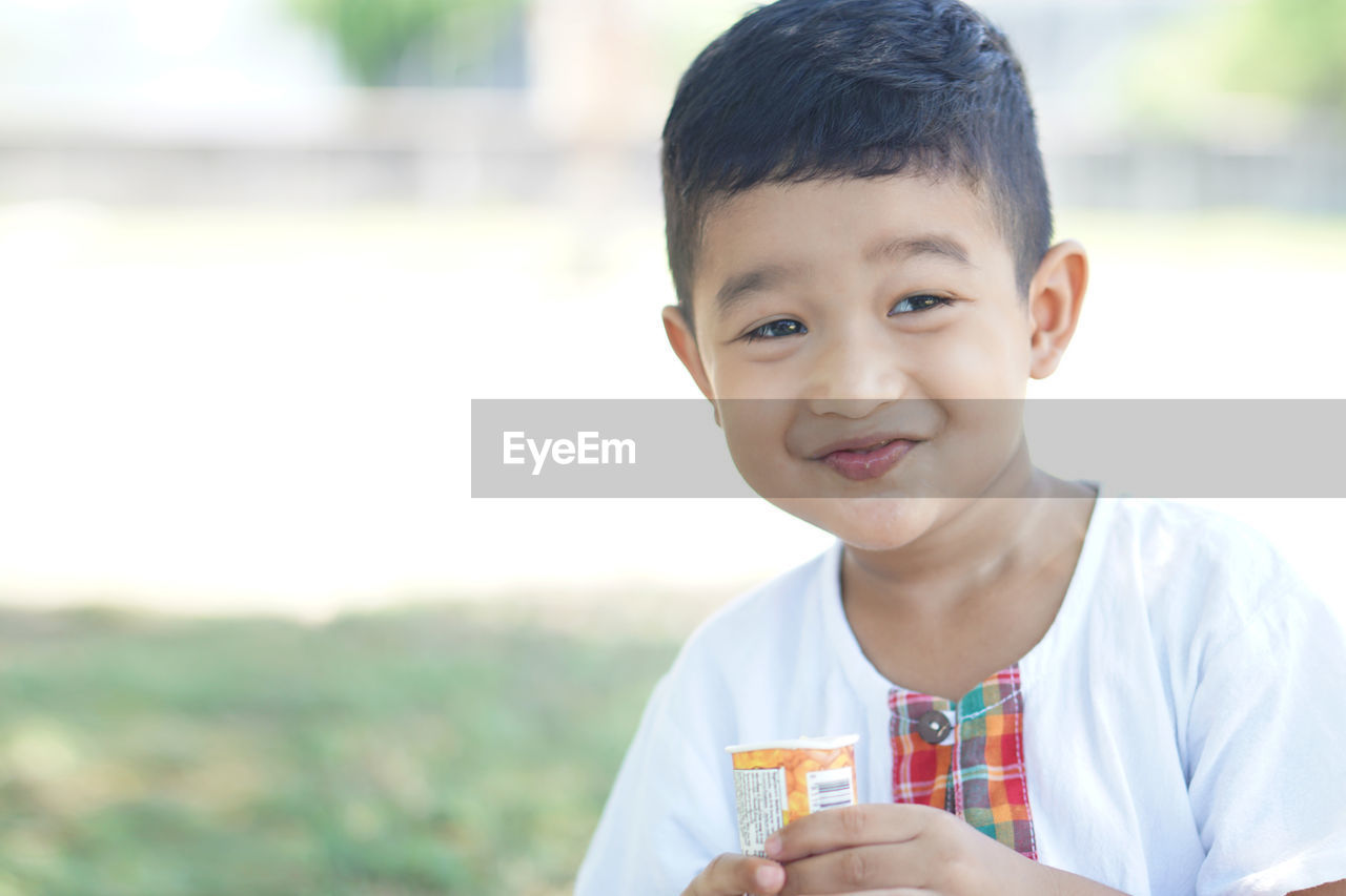 Portrait of cute boy smiling