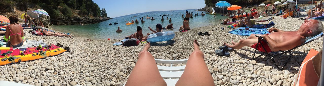 Panoramic shot of people at beach