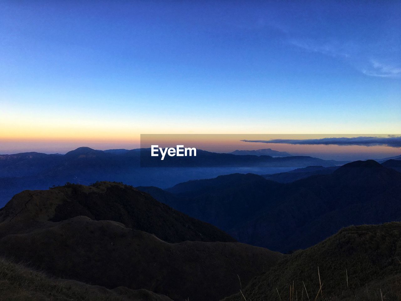 SCENIC VIEW OF MOUNTAINS AGAINST SKY DURING SUNSET