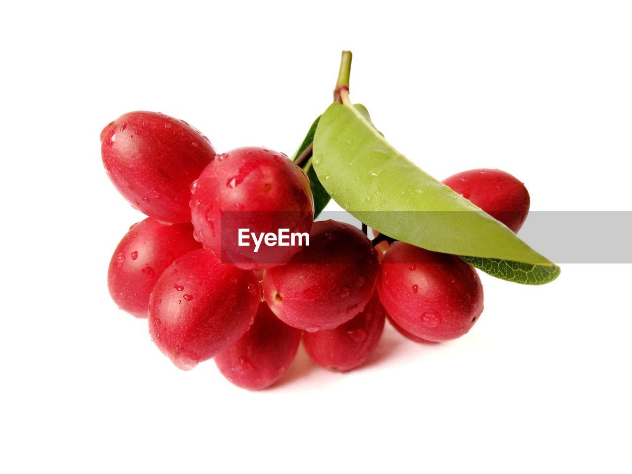 CLOSE-UP OF STRAWBERRIES AGAINST WHITE BACKGROUND