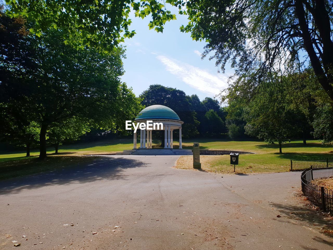 Built structure by trees against sky