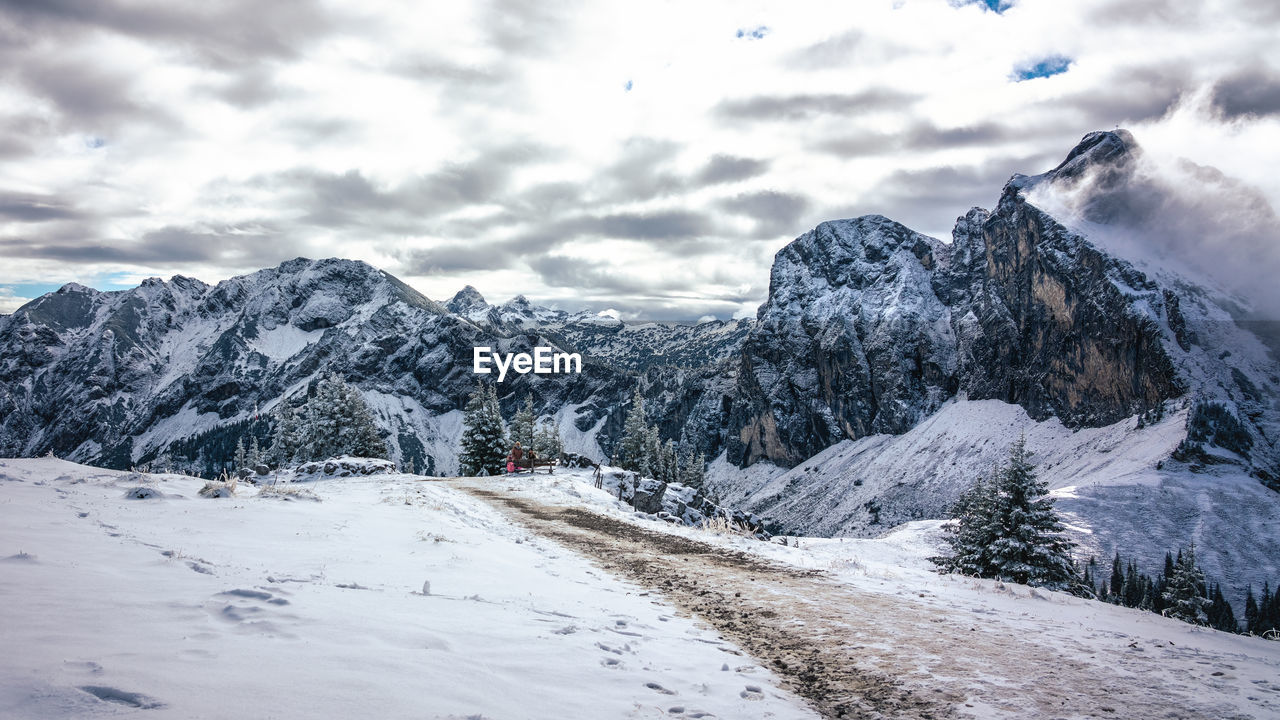 Scenic view of snowcapped mountains against sky