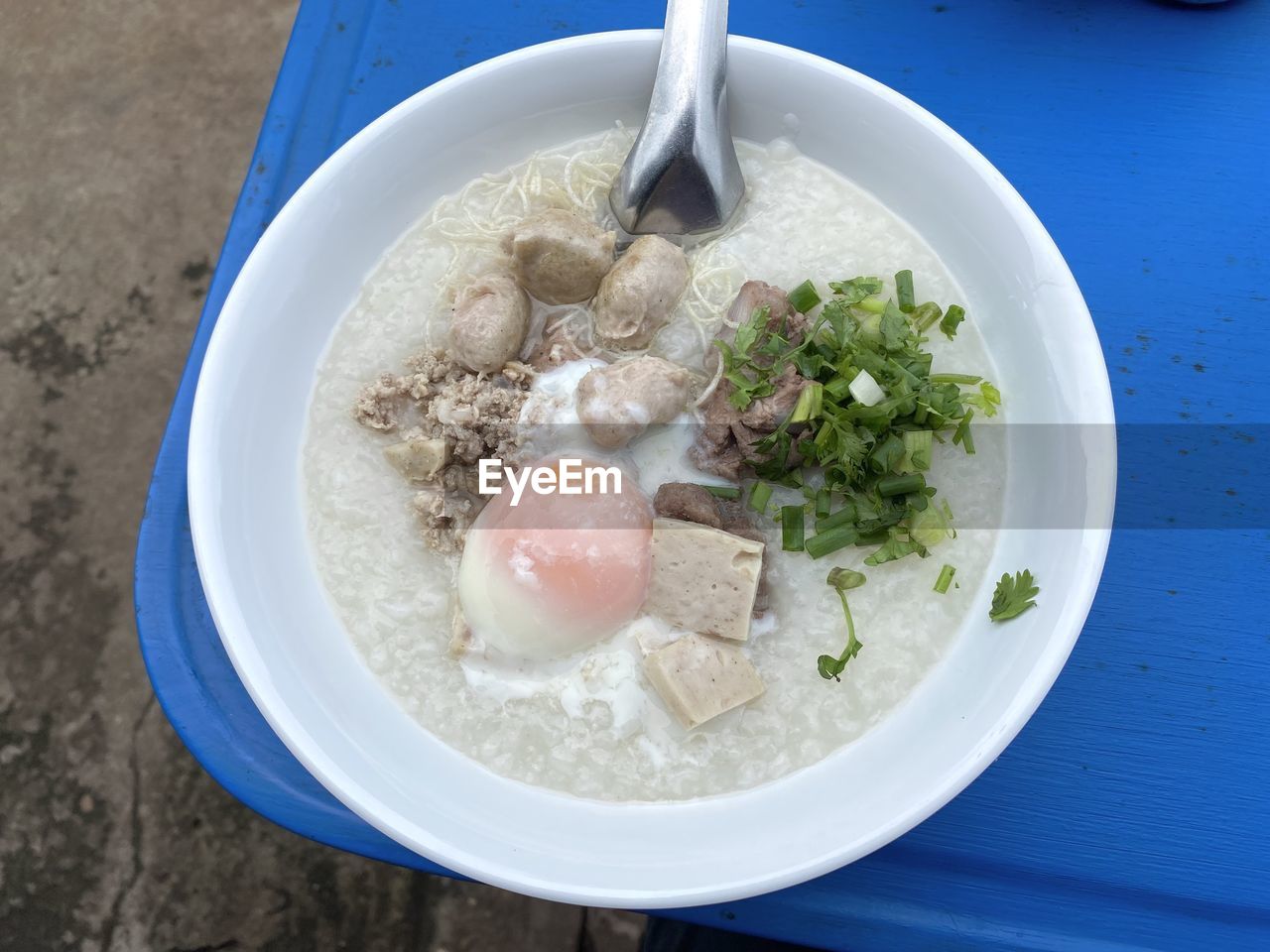 food and drink, food, healthy eating, dish, wellbeing, bowl, freshness, meal, vegetable, high angle view, soup, cuisine, table, no people, meat, kitchen utensil, indoors, produce, eating utensil, plate, asian food, blue, breakfast, egg