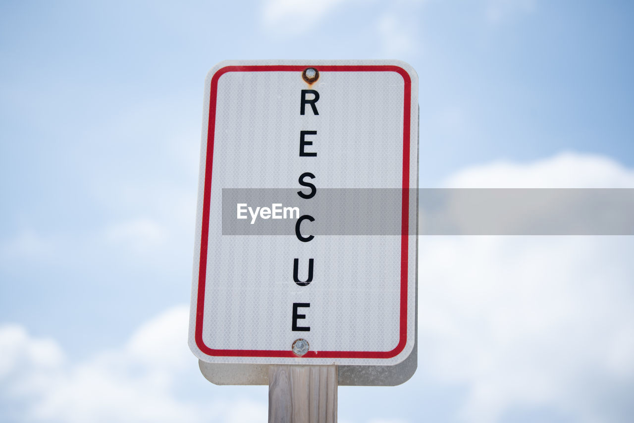sky, cloud, sign, communication, traffic sign, road sign, signage, text, no people, day, guidance, nature, blue, road, number, street sign, outdoors, close-up, western script, symbol, red