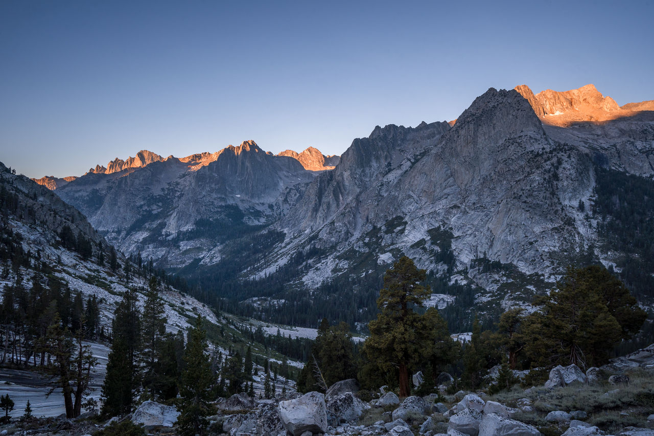 Scenic view of snowcapped mountains against clear sky during winter