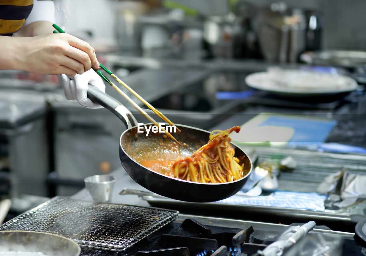 cropped hand preparing food