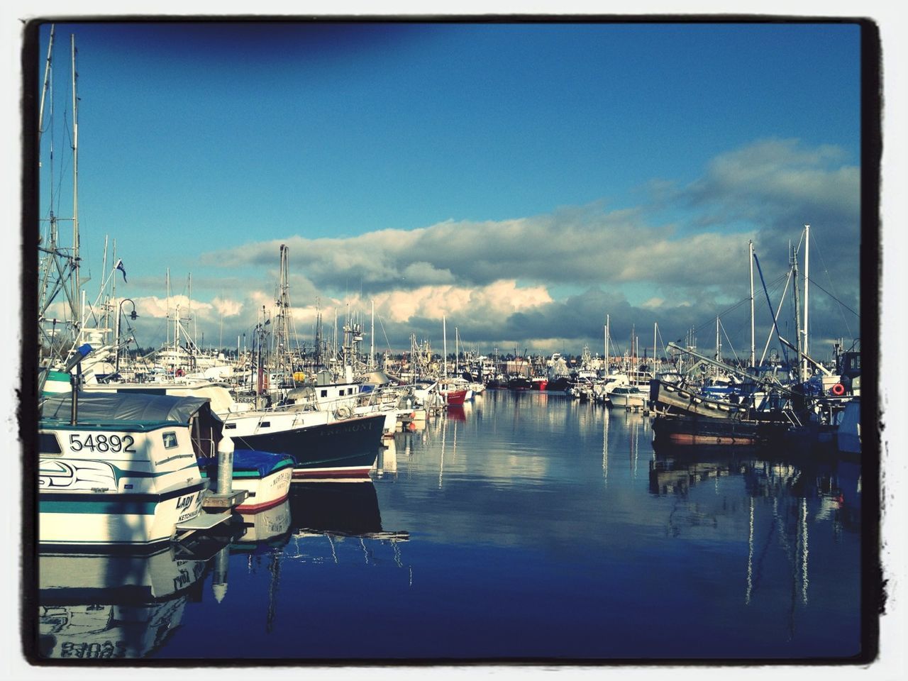 BOATS MOORED IN HARBOR