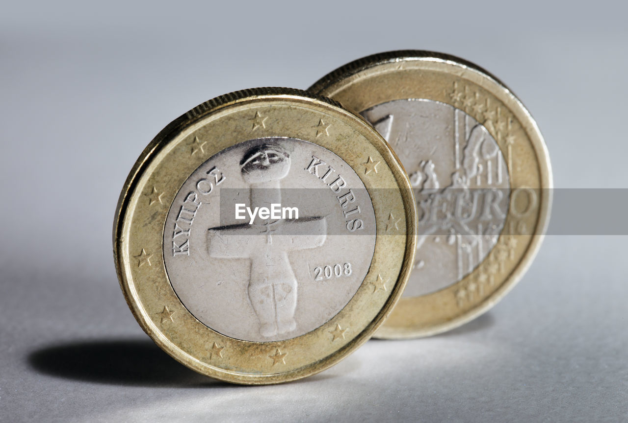 Close-up of coins on white background