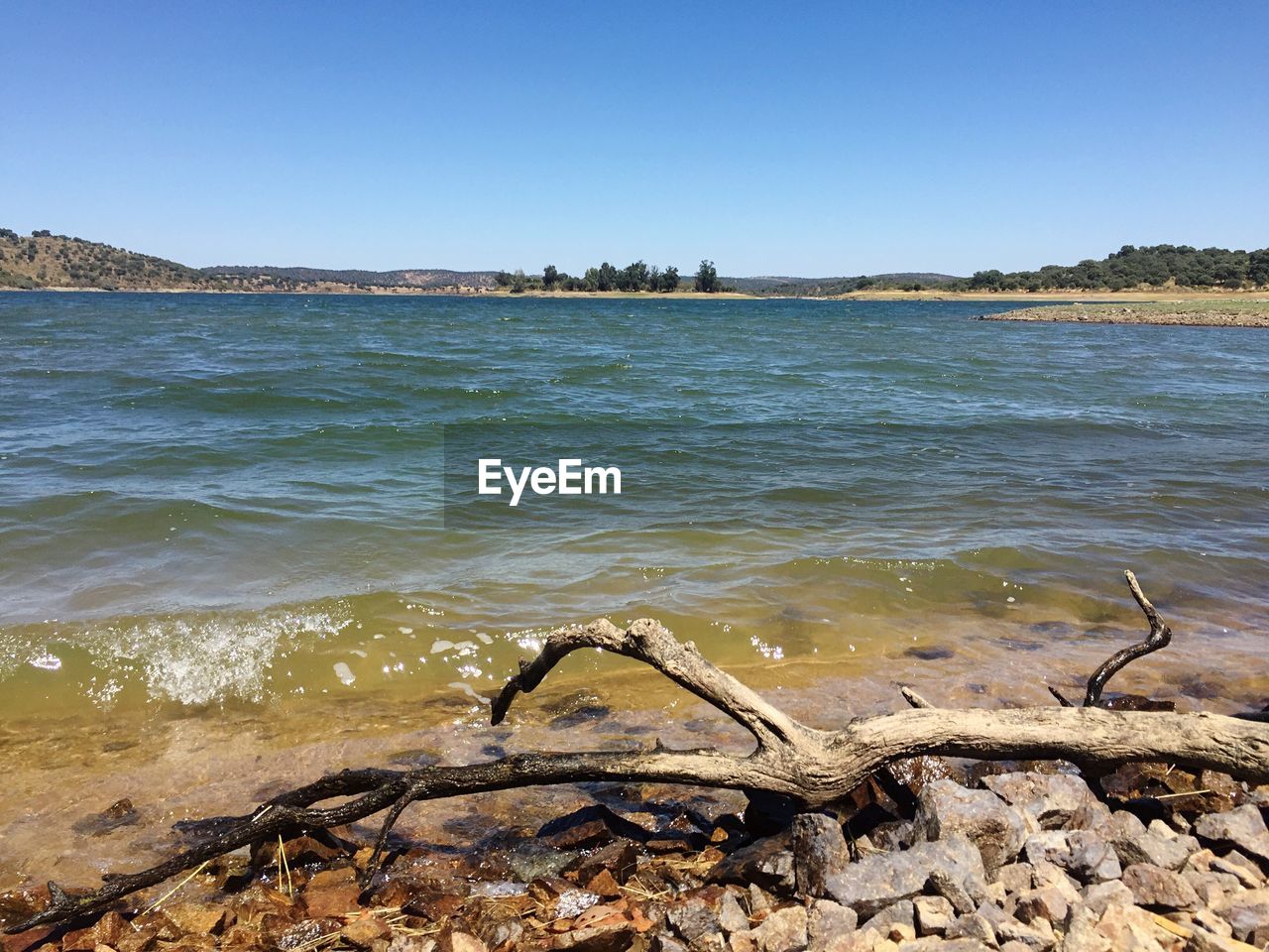 SEA SHORE AGAINST CLEAR SKY