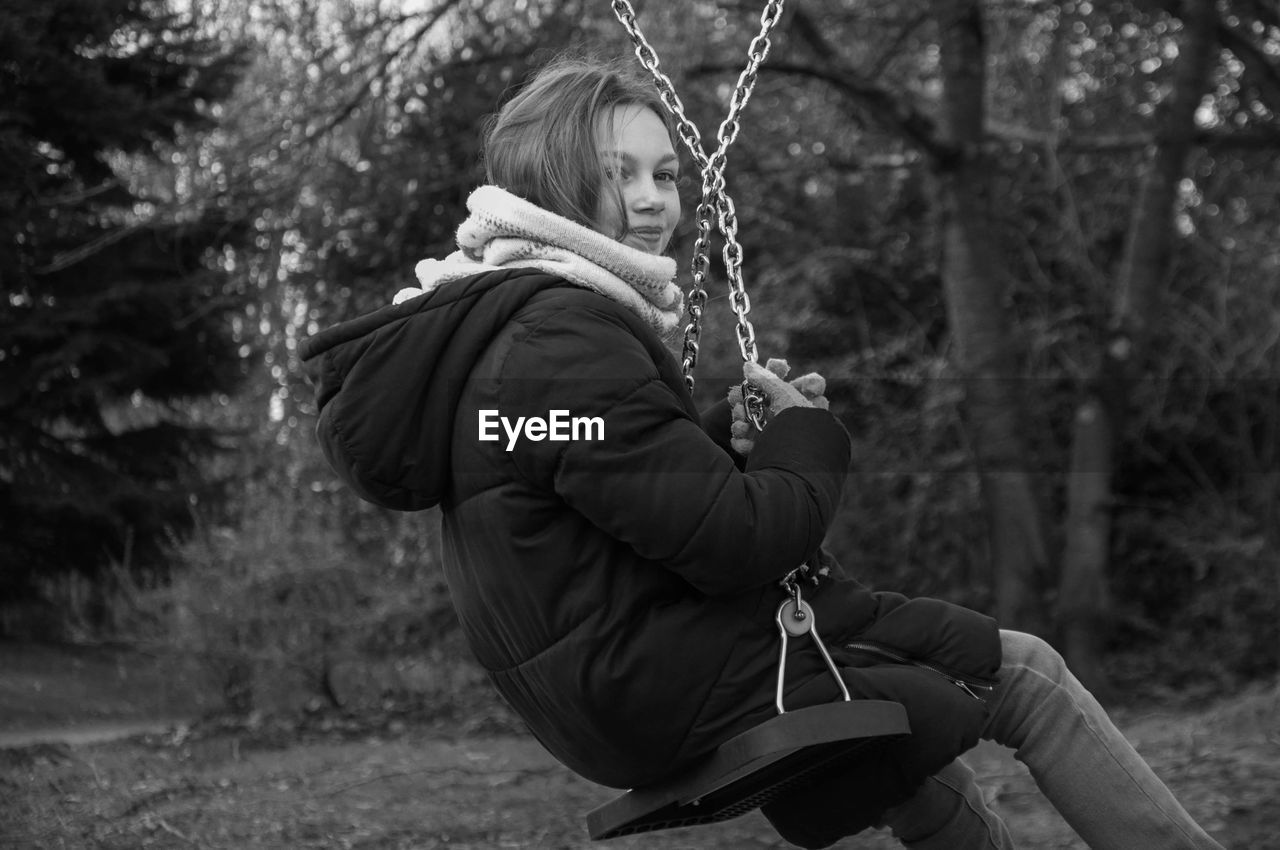 Man sitting on swing