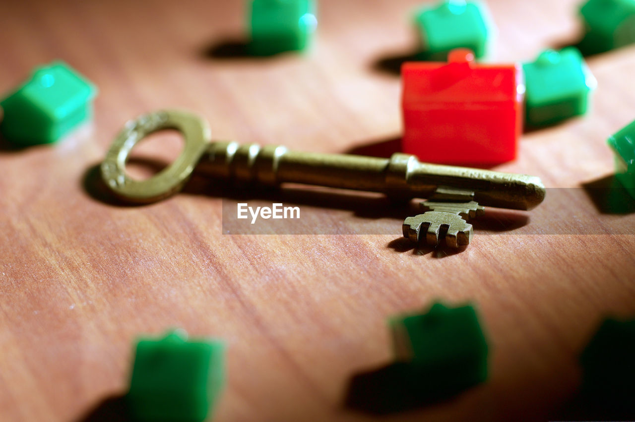 Close-up of key by model homes on table