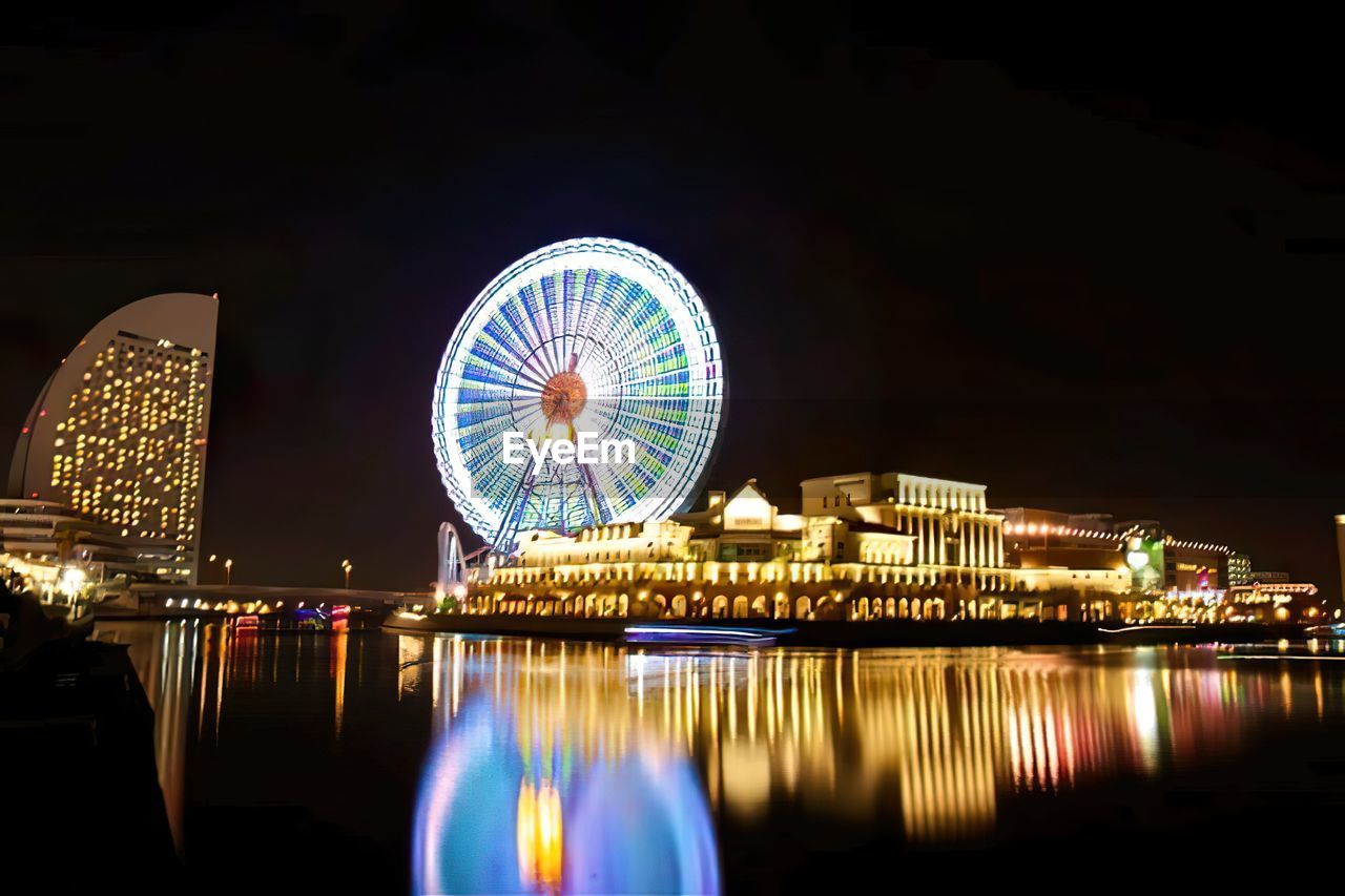 ILLUMINATED FERRIS WHEEL IN CITY