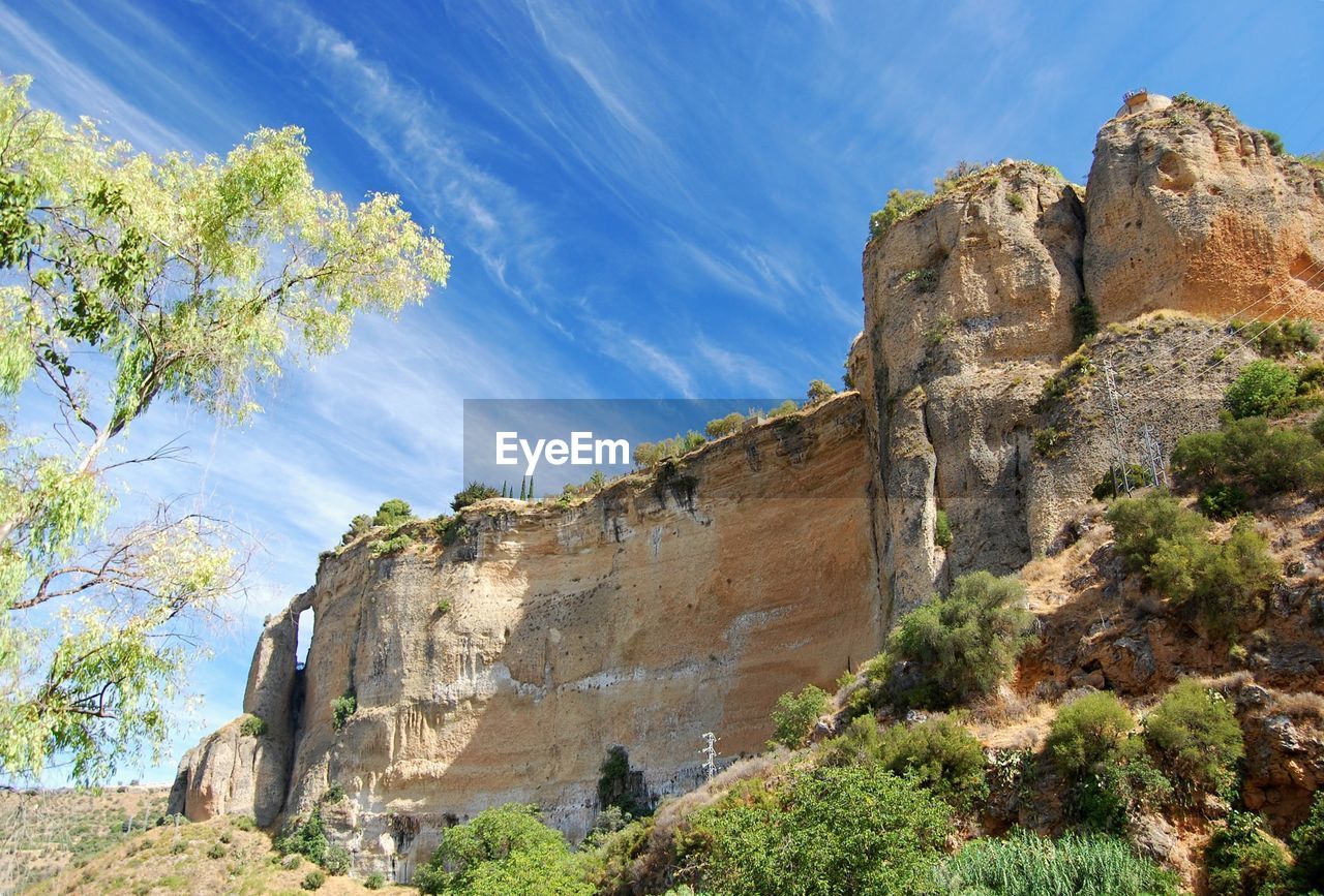 LOW ANGLE VIEW OF ROCK FORMATIONS