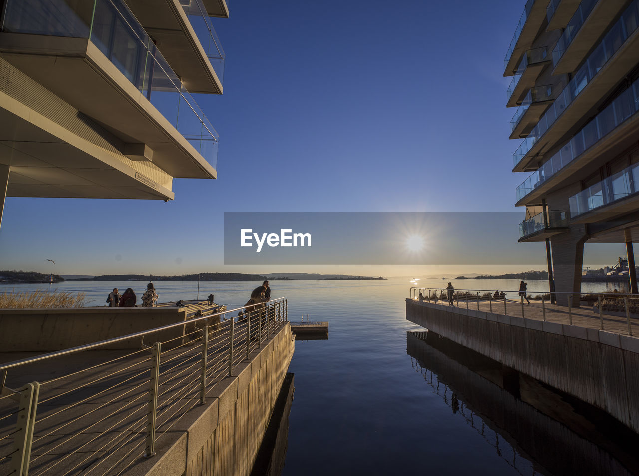 PIER OVER SEA AGAINST CLEAR SKY