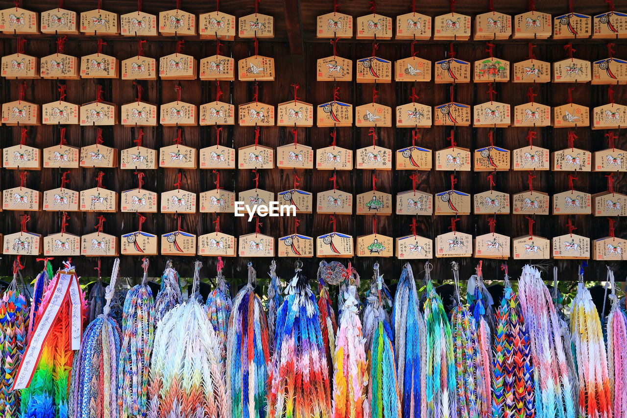 Full frame shot of colorful souvenirs hanging for sale in market