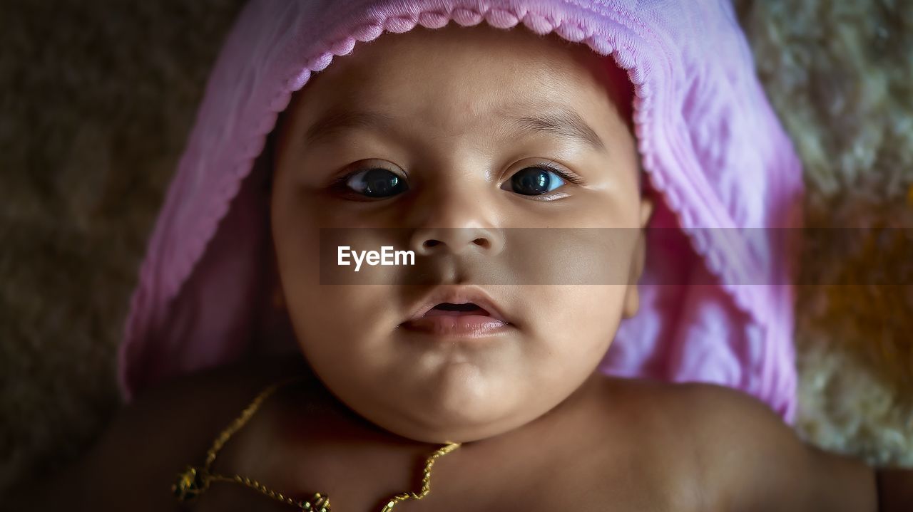 child, portrait, childhood, baby, pink, skin, one person, headshot, cute, human eye, innocence, person, human face, looking at camera, emotion, close-up, clothing, front view, sadness, indoors, purple, women, human head, female, portrait photography, nose, toddler, facial expression, eye, looking, babyhood, fashion accessory