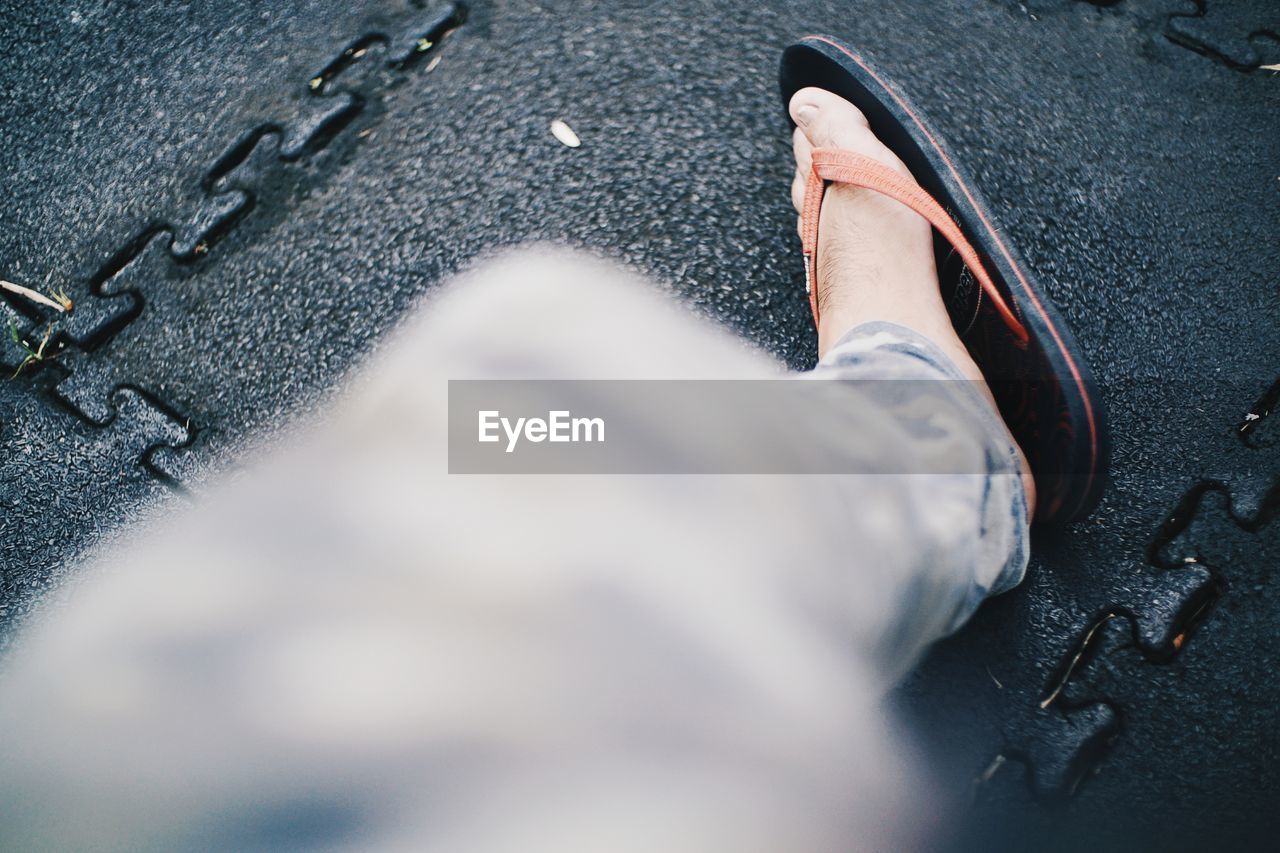 LOW SECTION OF MAN WEARING SHOES